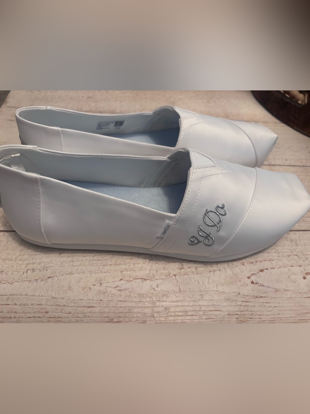 Toms Women's White Slip-On Flats with Script Embroidery